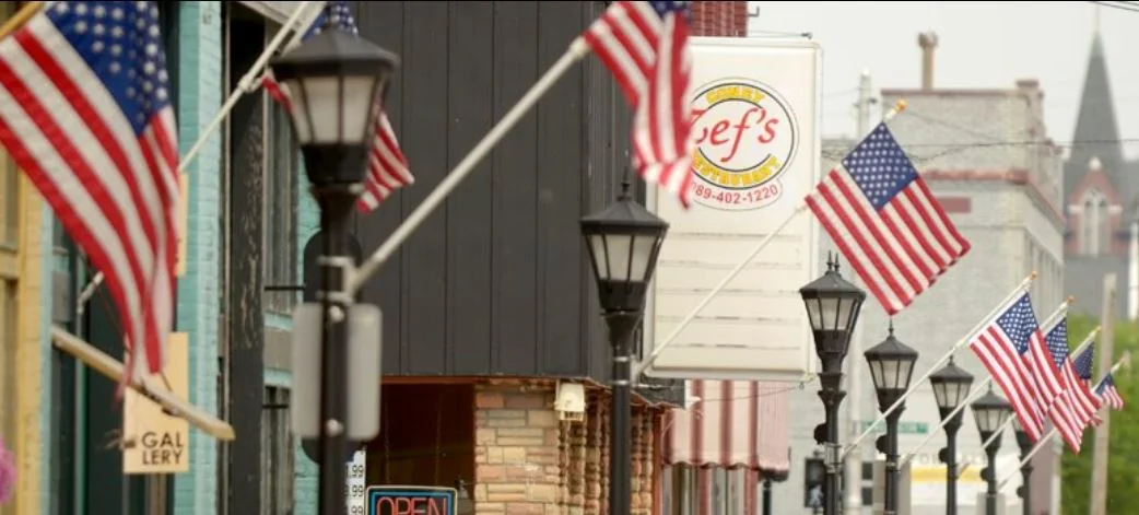 American flags displayed along a Bay City street